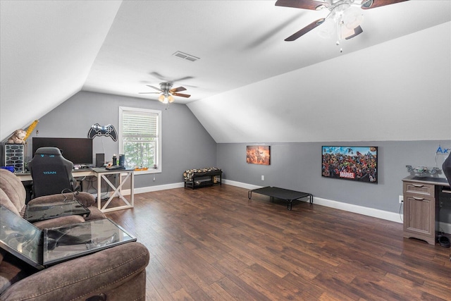 living room with dark wood-type flooring, vaulted ceiling, and ceiling fan