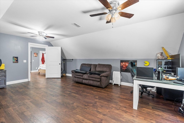 office area featuring radiator heating unit, dark wood-type flooring, vaulted ceiling, and ceiling fan