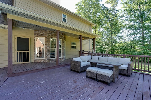 wooden deck with an outdoor living space