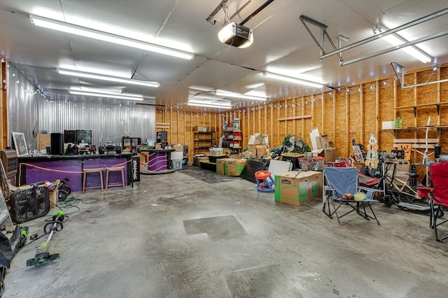 garage featuring a workshop area and a garage door opener