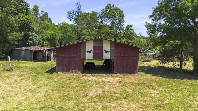 view of pole building with a yard