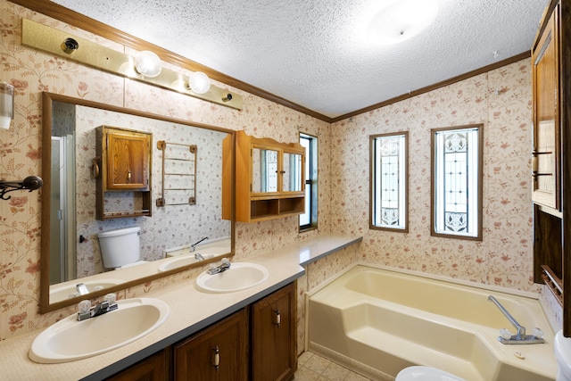 bathroom featuring a sink, ornamental molding, a garden tub, and a textured ceiling
