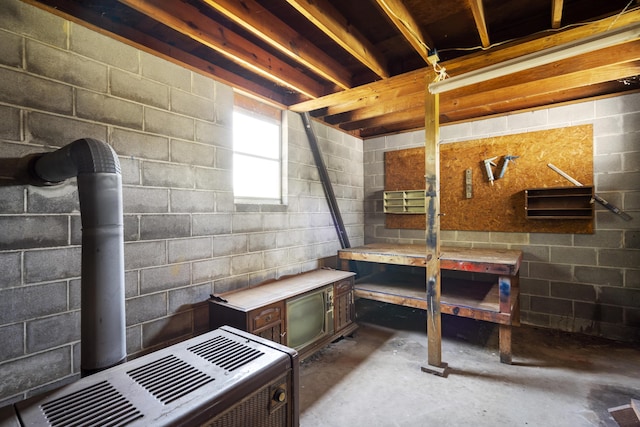 basement featuring concrete block wall