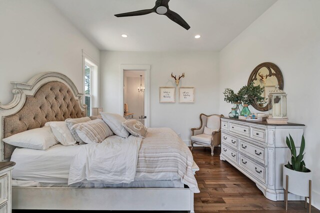 bedroom featuring ceiling fan and dark hardwood / wood-style floors