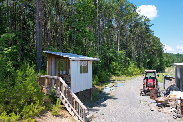 exterior space featuring a patio area and an outbuilding