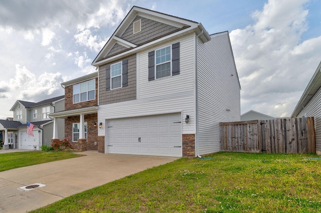 view of front of property with a garage and a front yard