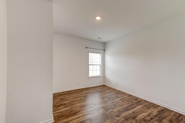 unfurnished room with dark hardwood / wood-style floors