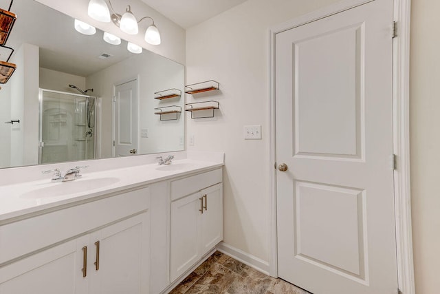 bathroom featuring walk in shower and vanity