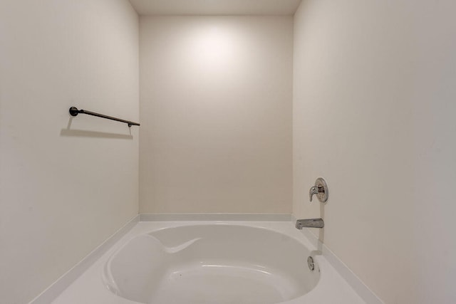 bathroom featuring a tub