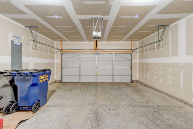 garage with a garage door opener and electric panel