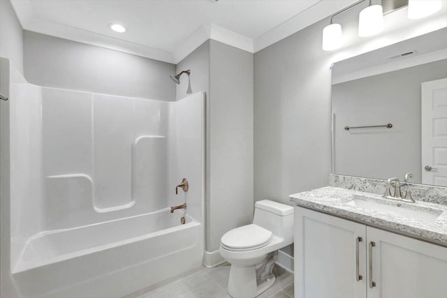 full bathroom featuring toilet, tile patterned floors, crown molding, vanity, and bathtub / shower combination