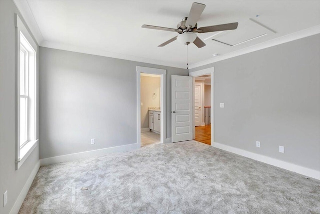 unfurnished bedroom with light carpet, ceiling fan, ensuite bathroom, and crown molding