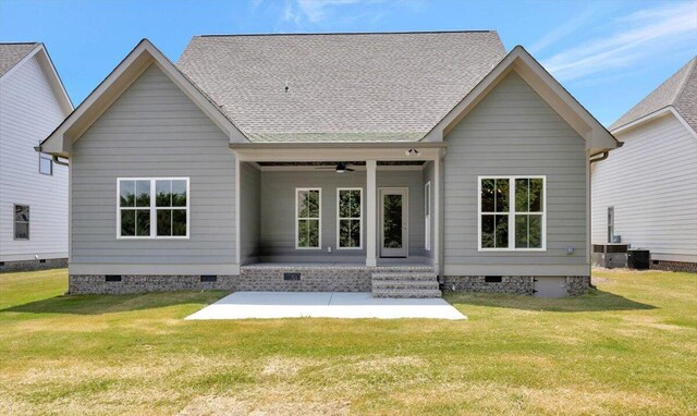 back of property featuring a ceiling fan, a yard, a patio area, and crawl space