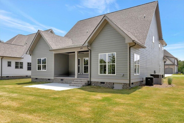 back of house featuring a lawn, a patio, and central AC unit