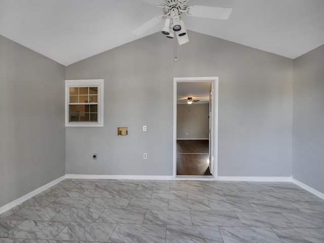 empty room featuring ceiling fan and vaulted ceiling