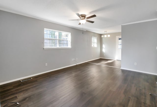 spare room featuring ornamental molding, ceiling fan, and dark hardwood / wood-style floors