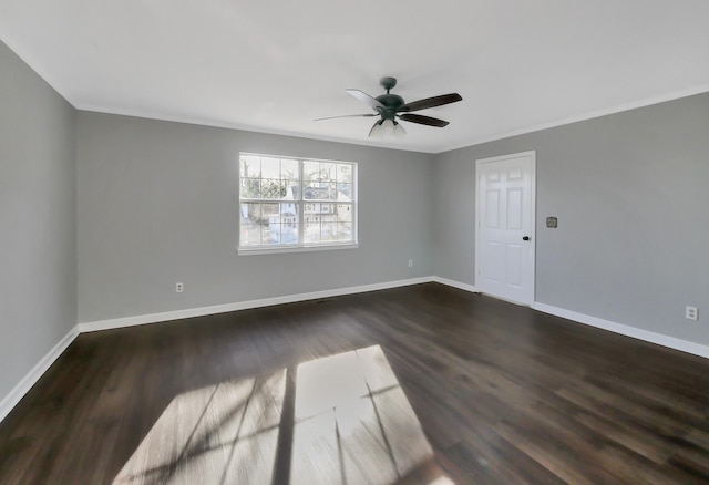 empty room featuring dark hardwood / wood-style flooring and ceiling fan