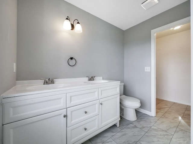 bathroom with vanity and toilet