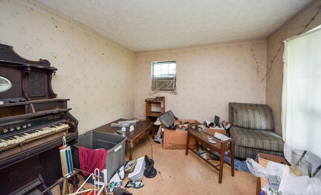 miscellaneous room featuring a textured ceiling and cooling unit