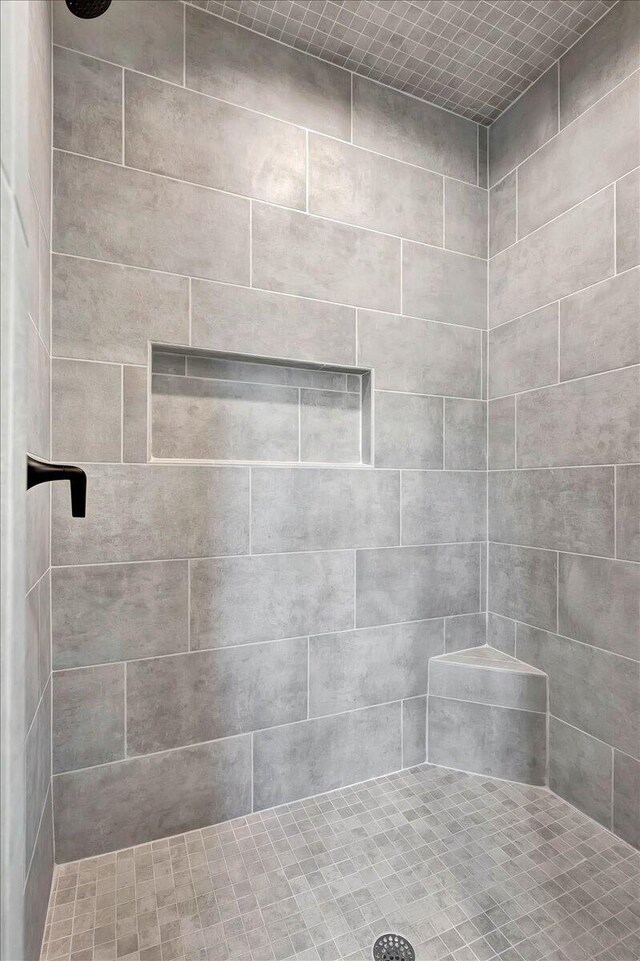 bathroom with a tile shower