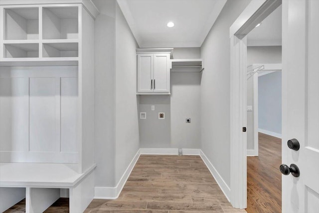 laundry room with baseboards, hookup for a washing machine, wood finished floors, cabinet space, and hookup for an electric dryer