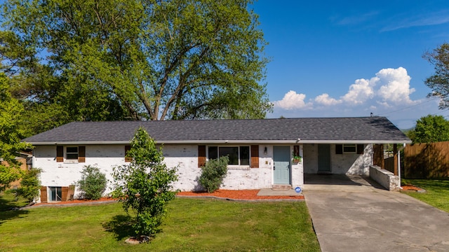 ranch-style home featuring a front yard