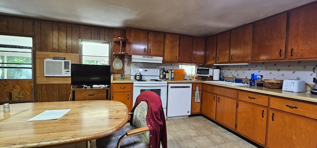 kitchen featuring white appliances and sink