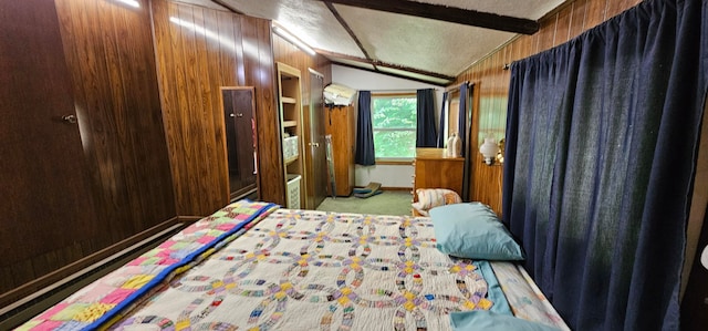 bedroom with a textured ceiling, vaulted ceiling, carpet floors, and wooden walls