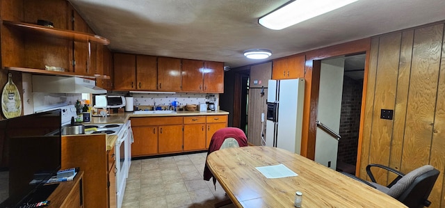 kitchen featuring sink and white appliances