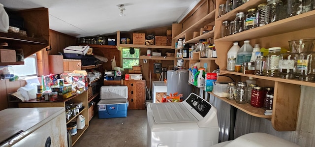 interior space with water heater and separate washer and dryer