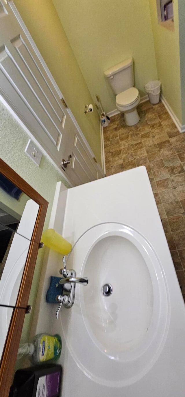 interior space with toilet and vanity