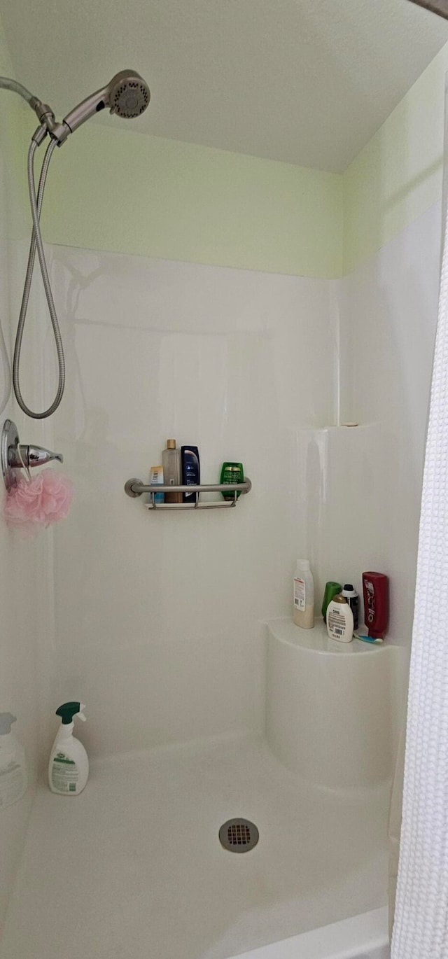 bathroom featuring walk in shower