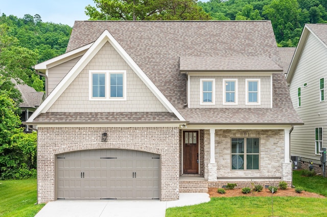 view of front of house with brick siding, roof with shingles, concrete driveway, and a front yard