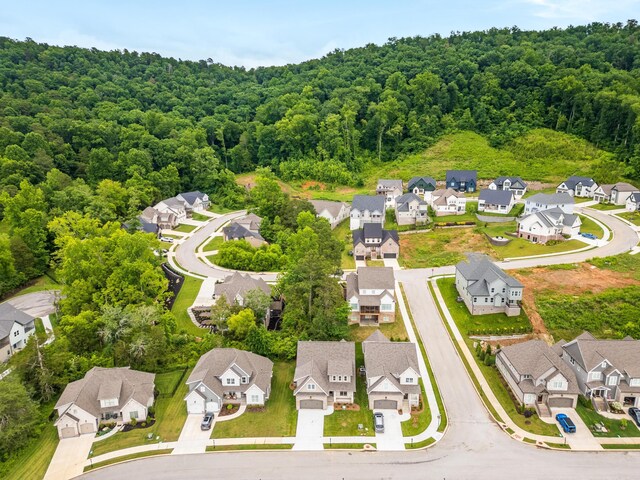 bird's eye view with a forest view and a residential view