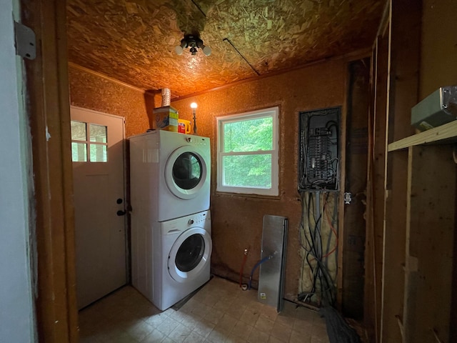 clothes washing area with stacked washer / drying machine