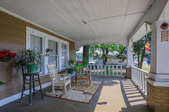 view of patio featuring a porch