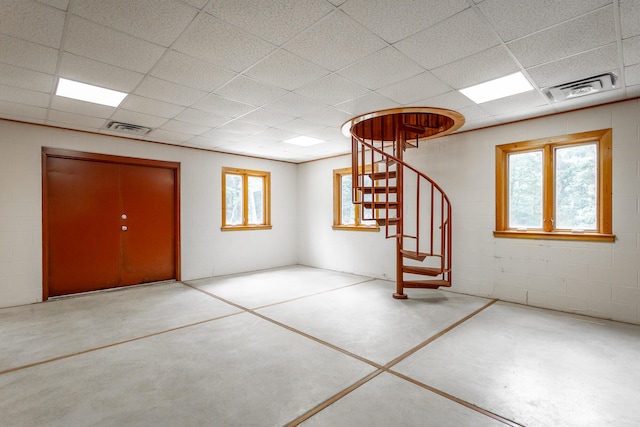 interior space featuring a drop ceiling