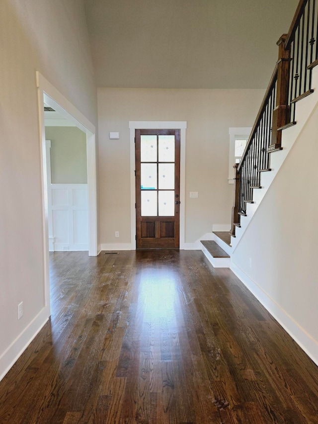 foyer entrance with dark wood-type flooring