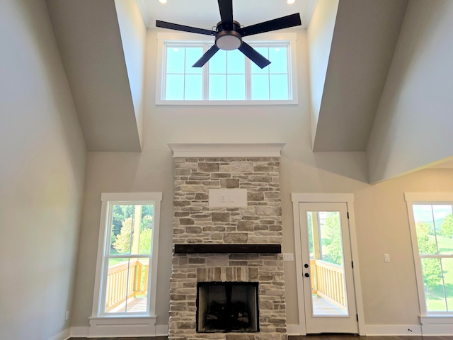 unfurnished living room with plenty of natural light and ceiling fan