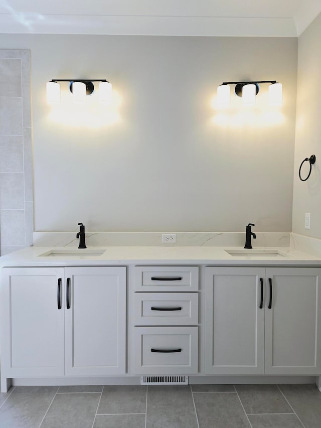 bathroom with vanity and tile patterned floors