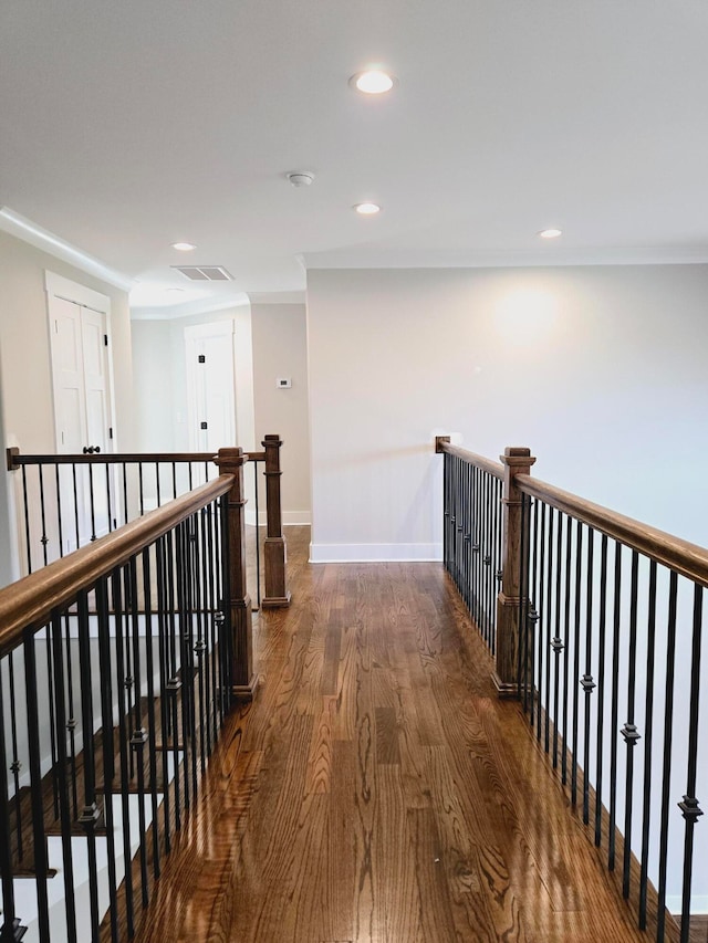 corridor with dark hardwood / wood-style flooring