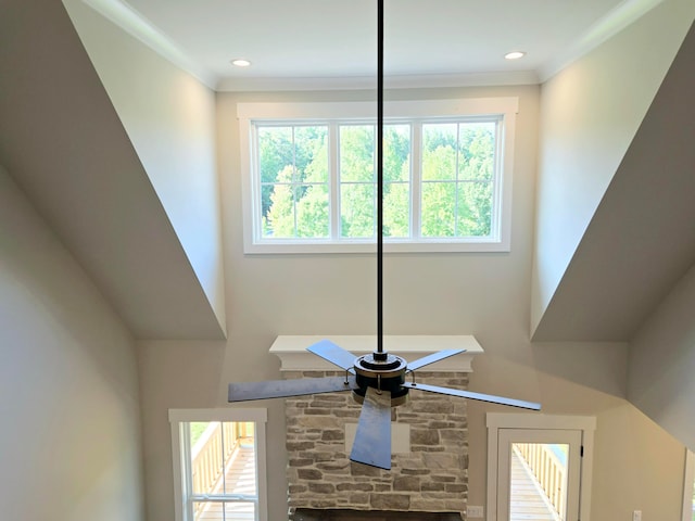 interior details with crown molding and ceiling fan