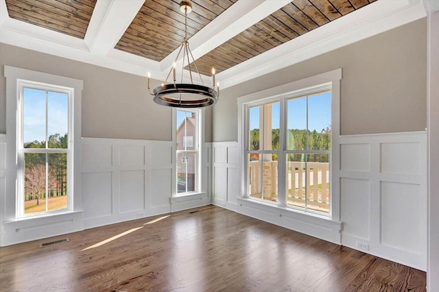 unfurnished dining area featuring wooden ceiling, visible vents, a decorative wall, and beamed ceiling