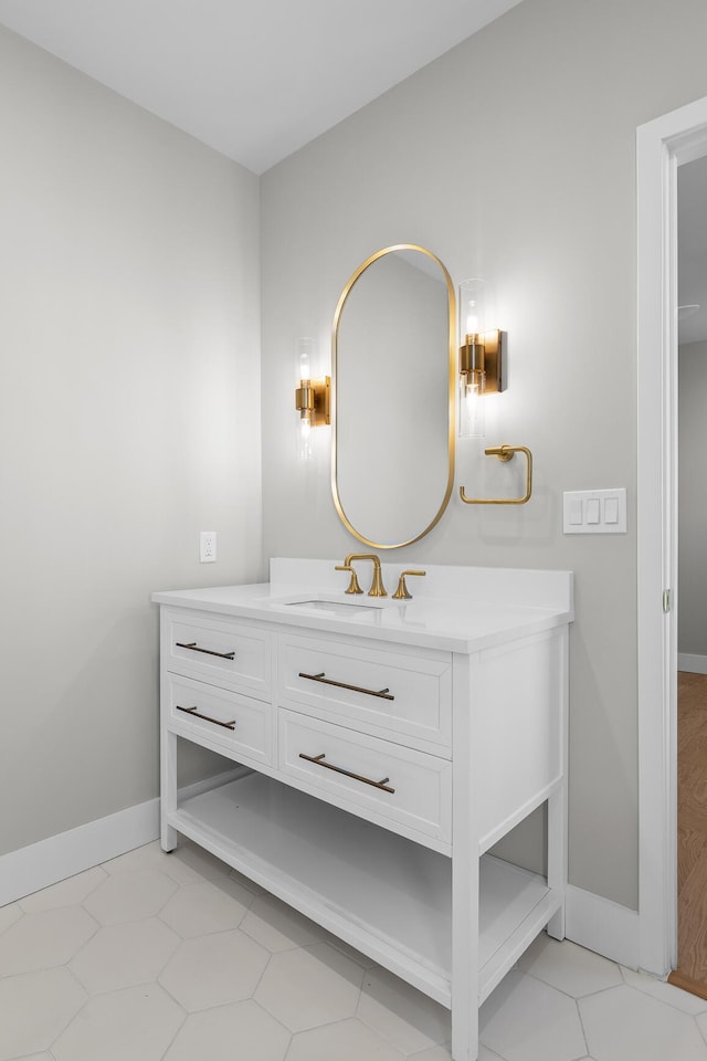 bathroom with vanity and baseboards