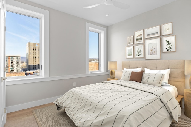 bedroom featuring ceiling fan and light wood-type flooring