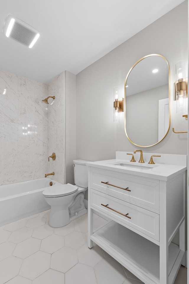 full bathroom with tile patterned floors, vanity, toilet, and tiled shower / bath