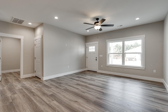 interior space featuring light hardwood / wood-style floors and ceiling fan