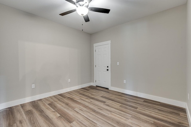 unfurnished room with ceiling fan and light wood-type flooring