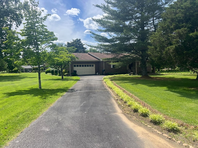 ranch-style house with a front lawn and a garage