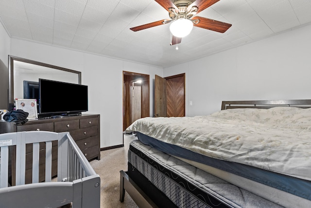 bedroom with light carpet and ceiling fan